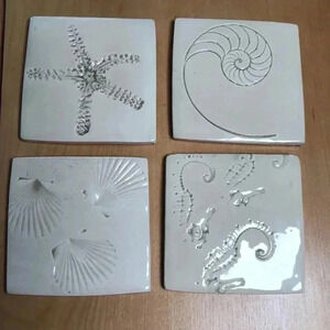 Set of four Earth Marks Studio ocean themed coasters.  Ivory. 4”x4”.